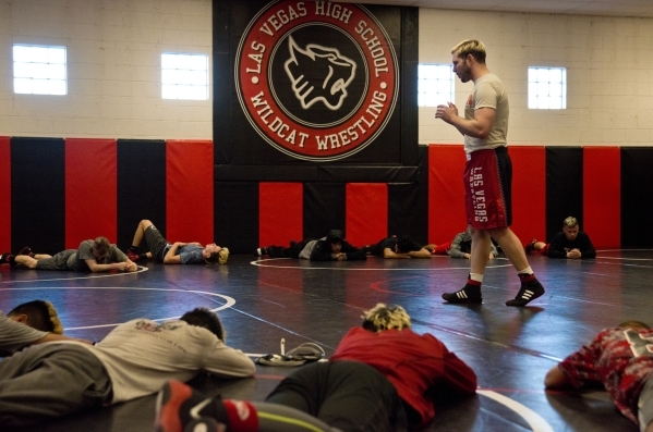 Las Vegas High School wrestling coach Zack Hocker uses guided meditation with his team durin ...