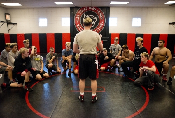 Las Vegas High School wrestling coach Zack Hocker speaks with his team during practice insid ...