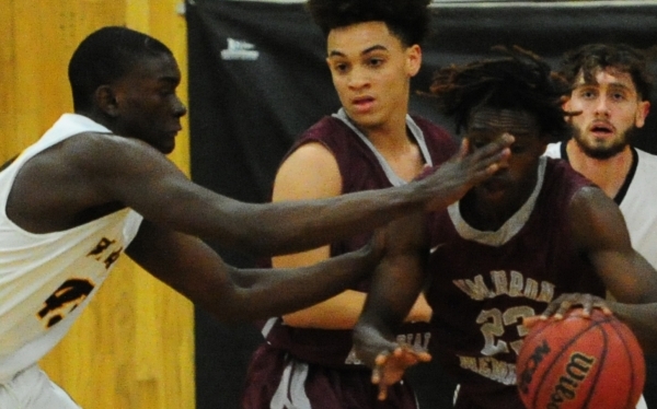 Bonanza center Garnet Walters, left, appears to accidentally hit Cimarron-Memorial guard Dem ...