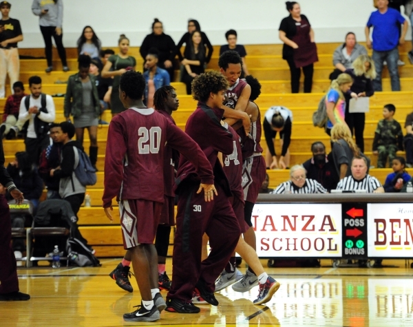 Cimarron-Memorial players celebrate their 51-50 win over Bonanza as time expires in the four ...