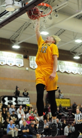Clark Chargers guard Trey Woodbury (22) dunks against Faith Lutheran in the fourth quarter o ...