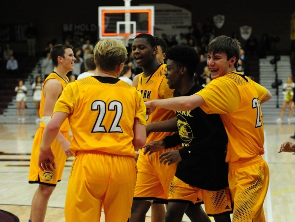 Clark Chargers celebrate thier 63-45 victory over Faith Lutheran during their prep basketba ...