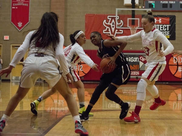Desert Oasis forward Ahmaya Smith (15) works the ball toward the basket during their game ag ...
