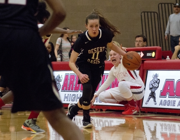 Desert Oasis guard Ashlynn Sharp (11) takes the ball up the court during their game against ...