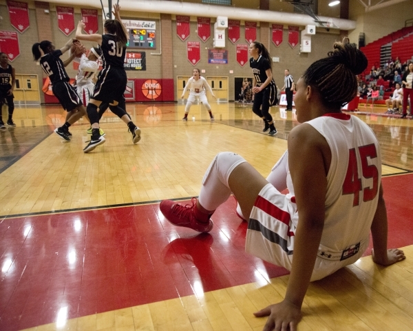 Arbor ViewÂ´s Autumn Westmoreland (45) sits on the court after falling while attempting a ...