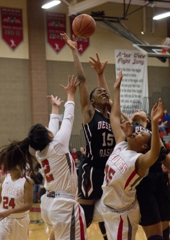 Desert Oasis forward Ahmaya Smith (15) extends above other players for the ball during their ...