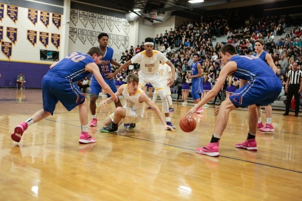 Durango senior Donte Wesley (14) along with Bishop Gorman seniors Zach Collins (12) and Trav ...