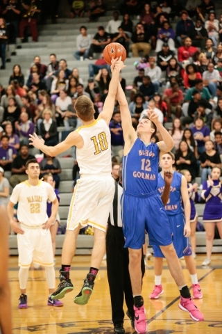 Durango senior Jason Landman (10) and Bishop Gorman senior Zach Collins (12) jump for the ba ...