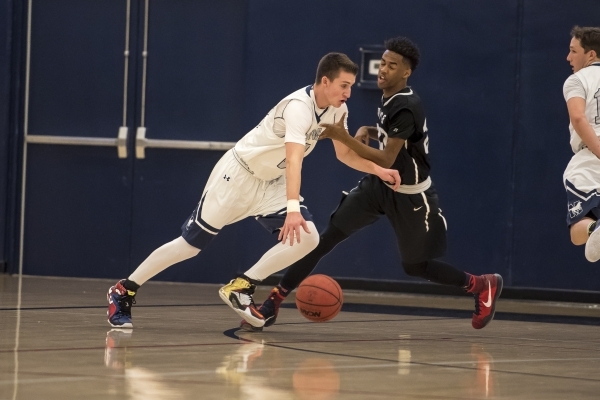 Meadows Mustangs guard Jake Epstein (23) pushes past Mountain View Saints guard Tyrell Brook ...