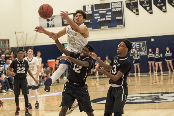 Meadows Mustangs center Max Hisatake (22) reaches for a ball over the head of Mountain View ...