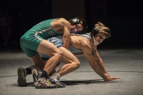 Green Valley‘s Desmond Bowers, top, wrestles Foothill‘s Kohl Velado during their ...