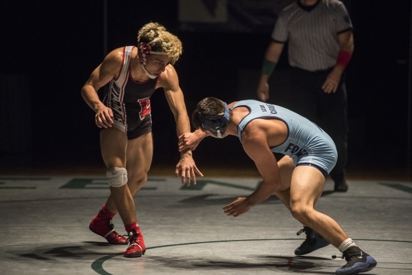 Las Vegas High‘s Nick Saban, left, wrestles Foothill‘s Jacob Chavez during their ...