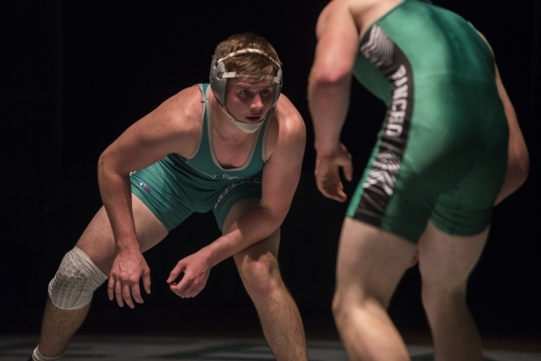 Green Valley‘s Jared Temple, left, wrestles Rancho‘s Alex Arone during their 170 ...