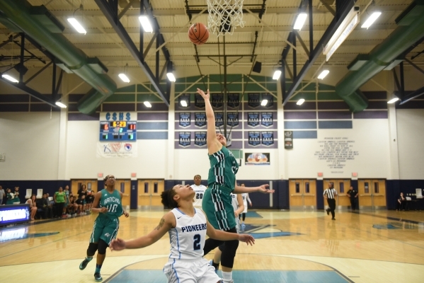 Rancho‘s Tatianna Lee (21) goes up for a shot against Canyon Springs Aleza Bell (2) du ...