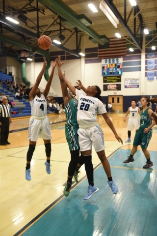 Canyon Springs Kamille Smith (4) and Alexia Thrower (20) battle for a rebound against Rancho ...