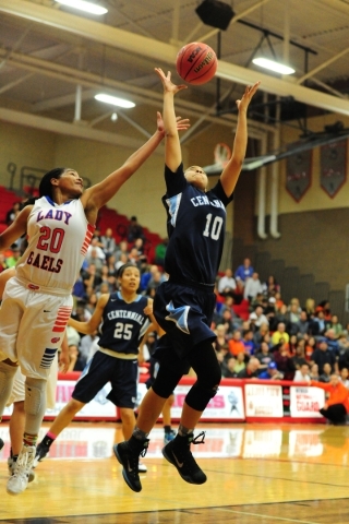 Centennial guard Jayden Eggleston (10) catches a rebound in front of Bishop Gorman forward S ...