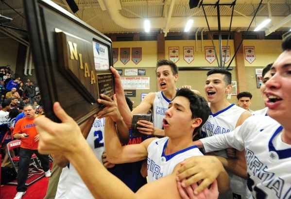 Bishop Gorman players celebrate their Sunset Region championship after defeating Centennial ...