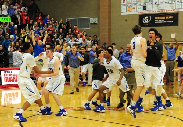 Bishop Gorman players celebrate their Sunset Region championship after defeating Centennial ...