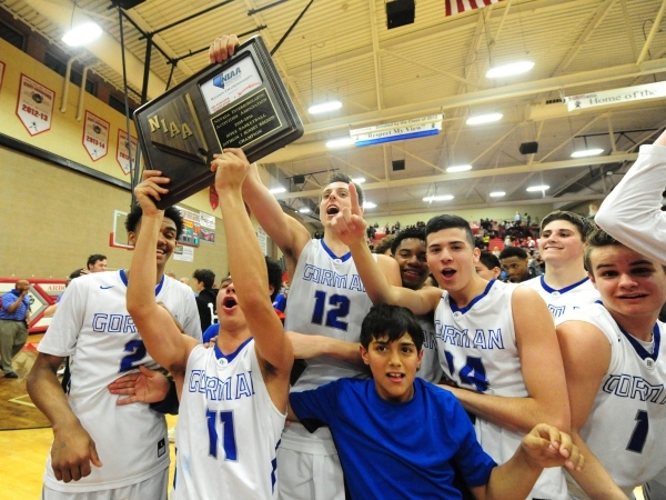 Bishop Gorman players celebrate their Sunset Region championship after defeating Centennial ...