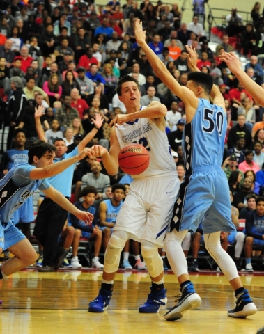 Centennial guard Roy Sparks, left, strips the ball from Bishop Gorman forward Zach Collins ( ...