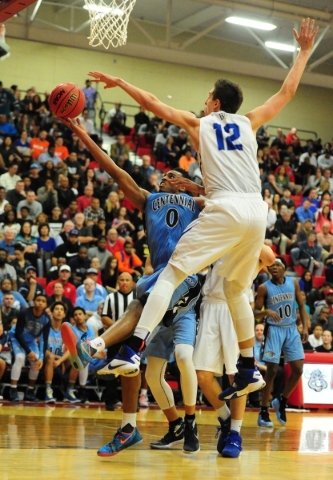 Centennial guard Troy Brown (0) goes up for a shot against Bishop Gorman forward Zach Collin ...