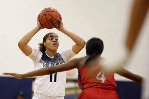 Spring Valley’s Kayla Harris looks to pass against Liberty High’s Starr Walker ( ...
