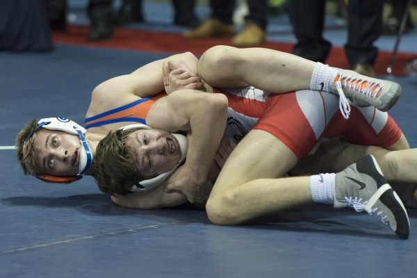 Mason Campbell, back, of Bishop Gorman High School wrestles Dawson ...