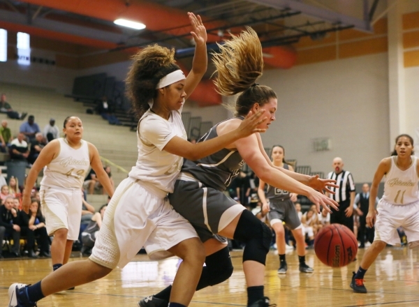 Spring ValleyÂ´s Lynnae Wilds, left, guards Faith LutheranÂ´s Maddy Larson during a NIAA ...