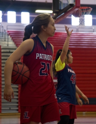 Liberty‘s Kaily Kaimikaua (21) looks over the court during practice at Liberty High Sc ...