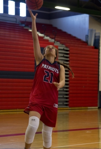 Liberty‘s Kaily Kaimikaua (21) takes the ball to the basket during practice at Liberty ...