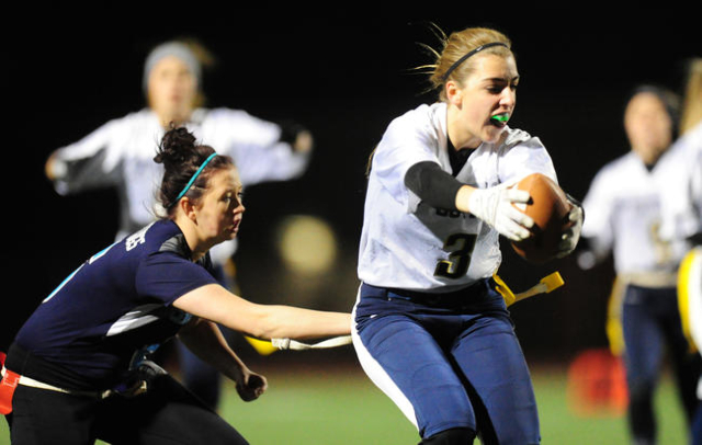 Centennial Courtney Reeves pulls the flag off of Foothill wide receiver Emily Mull (3) in th ...