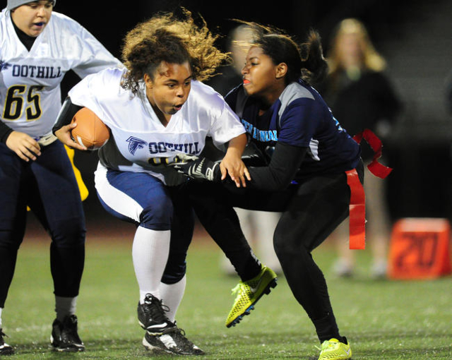 Foothill running back Chloe Collins, left, collides with Centennial safety Chantay Dixon aft ...