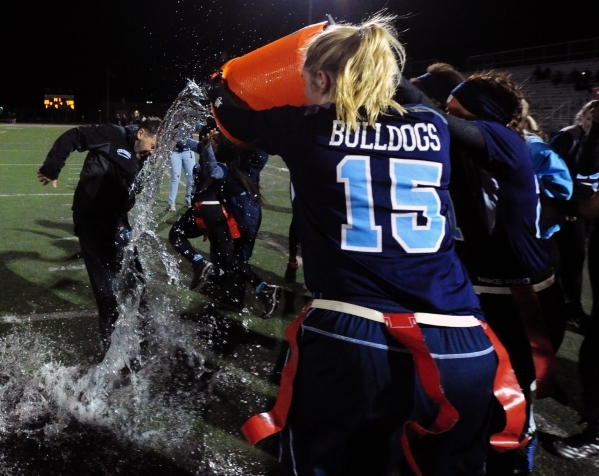 Centennial players dunk head coach John Roberts with water after defeating Foothill in the C ...