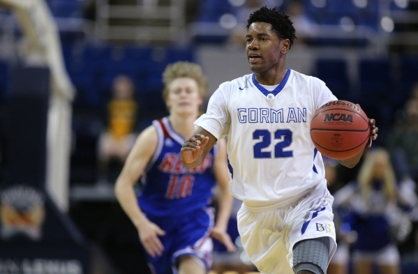 Bishop Gorman‘s Christian Popoola Jr. brings the ball up the court against Reno during ...