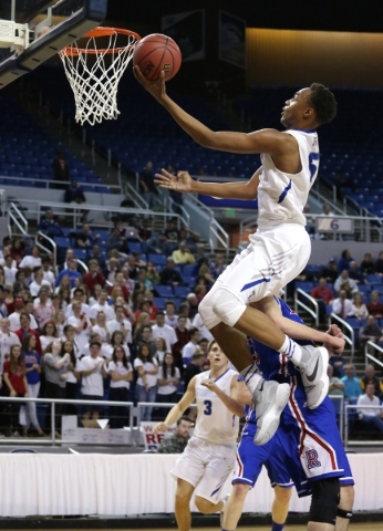 Bishop Gorman‘s Chuck O‘Bannon shoots over Reno defender Michael Heydon during t ...