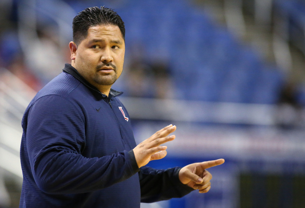 Liberty Head Coach Chad Kapanui works the sidelines of the NIAA Division I state basketball ...