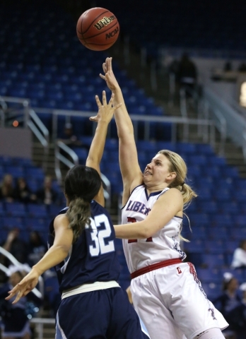 Liberty‘s Gabby Doxtator shoots over Centennial defender Megan Jefferson during the NI ...