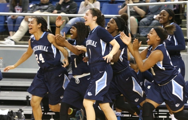Centennial Bulldogs celebrate after defeating Liberty 78-62 for the state title in the NIAA ...