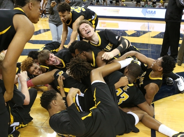 Clark celebrates their 43-39 over Desert Pines in the NIAA Division I-A state basketball cha ...