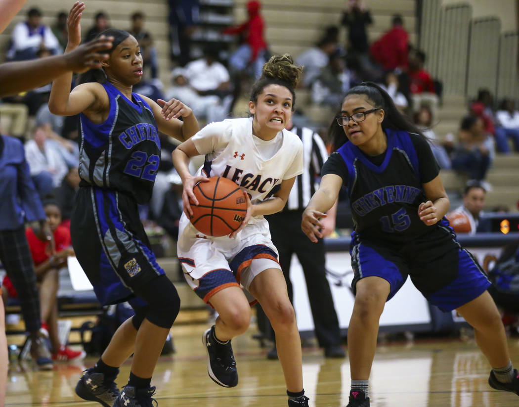 Legacy’s Rory Carter (23) drives to the basket against Cheyenne’s Brielle Jeffer ...