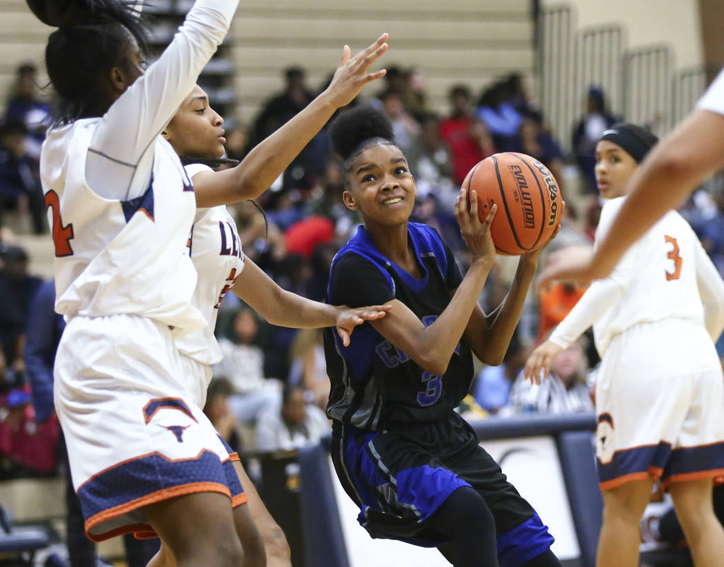 Cheyenne’s Jennifer Quintana (3) looks to shoot against Legacy during a basketball gam ...