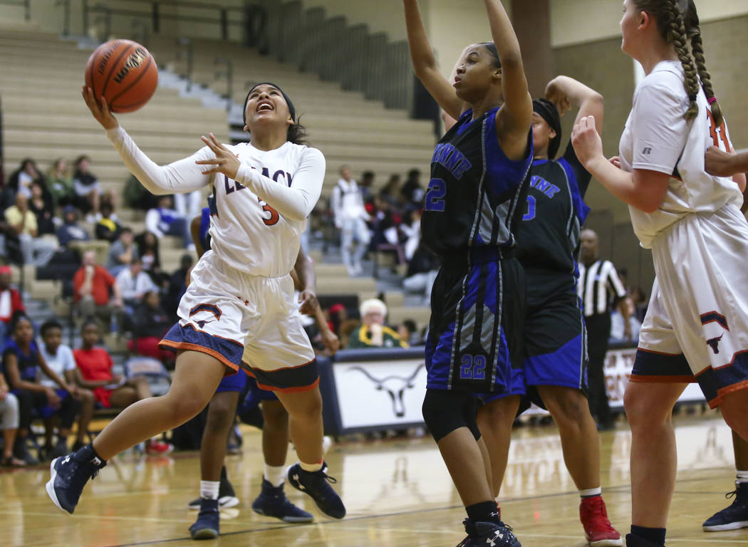 Legacy’s Taeha Pankey (3) goes up to shoot against Cheyenne during a basketball game a ...