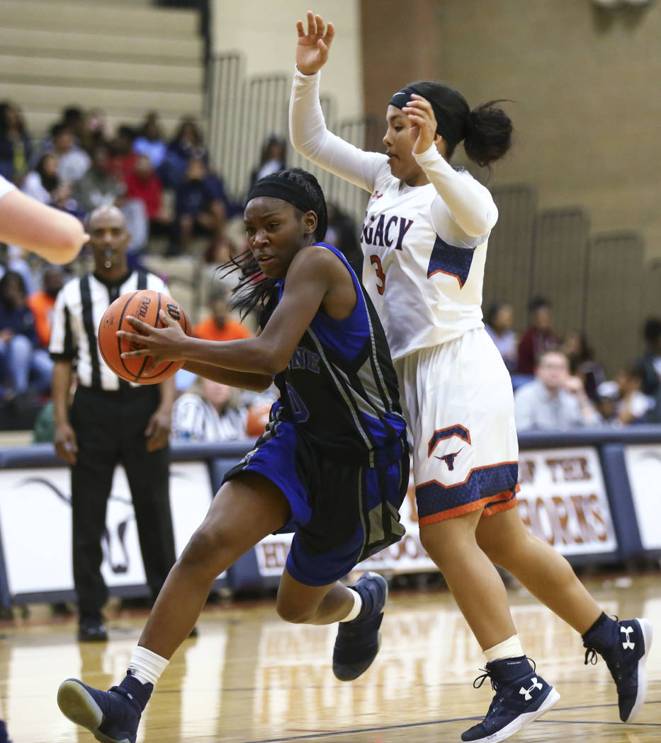 Cheyenne’s Almond Slayton (0) drives to the basket against Legacy’s Taeha Pankey ...