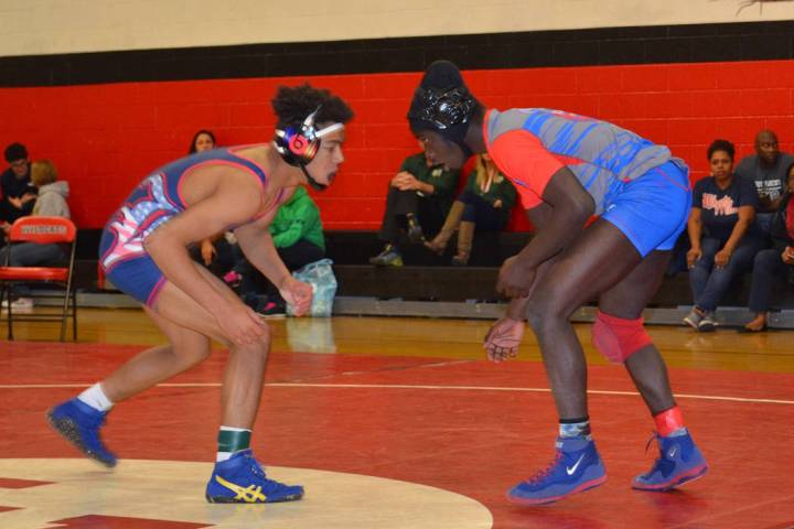 Valley 145-pounder Xzavier Maheia (right) looks to tie up with Liberty’s Jayden Rookhu ...