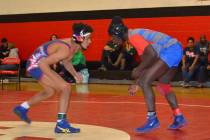 Valley 145-pounder Xzavier Maheia (right) looks to tie up with Liberty’s Jayden Rookhu ...