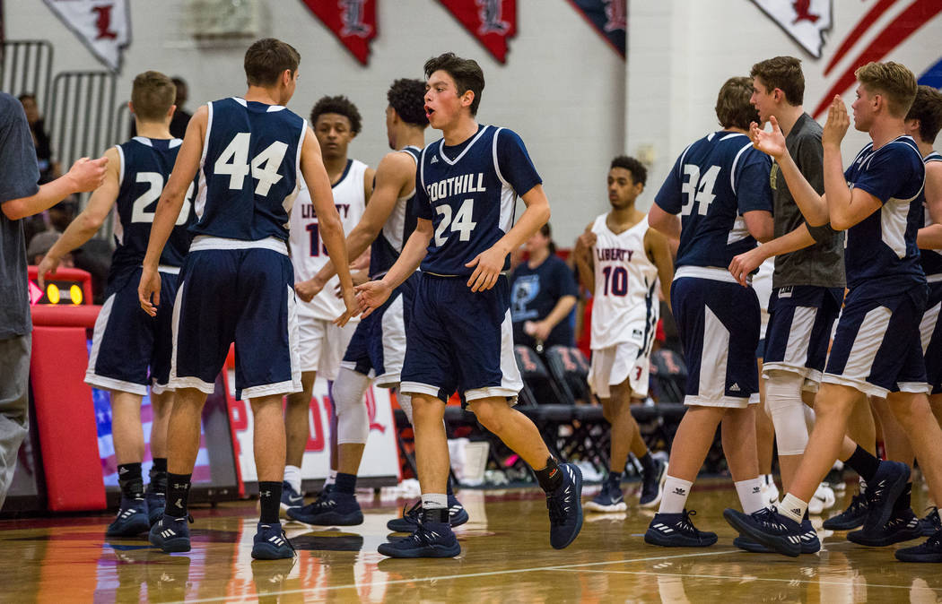 Foothill players cheer after defeating Liberty 69-65 at Liberty High School in Henderson on ...