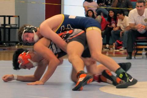 D.J. Reese of Boulder City, top, wrestles Marc Gonzales of Chaparral in the 132-pound champi ...