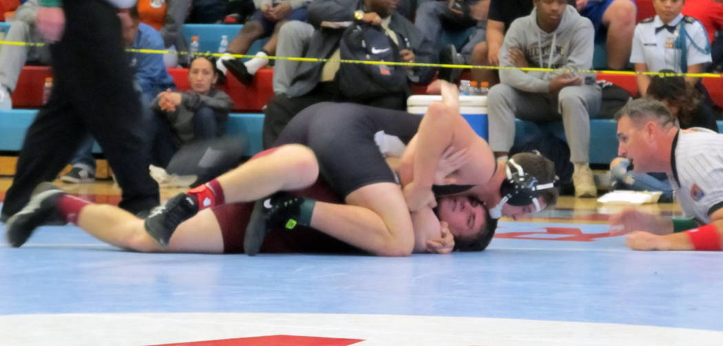 Cresent Crandall of Virgin Valley, top, wrestles Cole Walker of Pahrump Valley in the 182-po ...