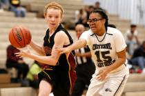 Pahrump Valley’s Makayla Gent (32) runs the ball against Cheyenne High’s Onolina ...