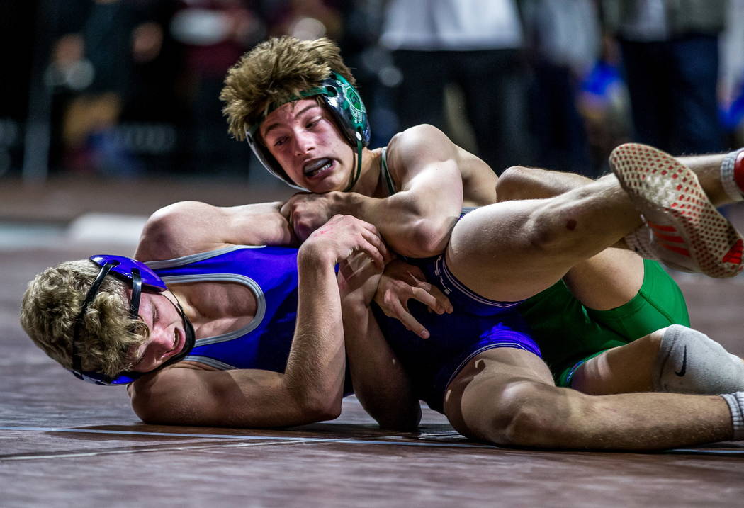 William Zernich of Green Valley attempts to pin down Owen Jones of Spanish Springs while wre ...